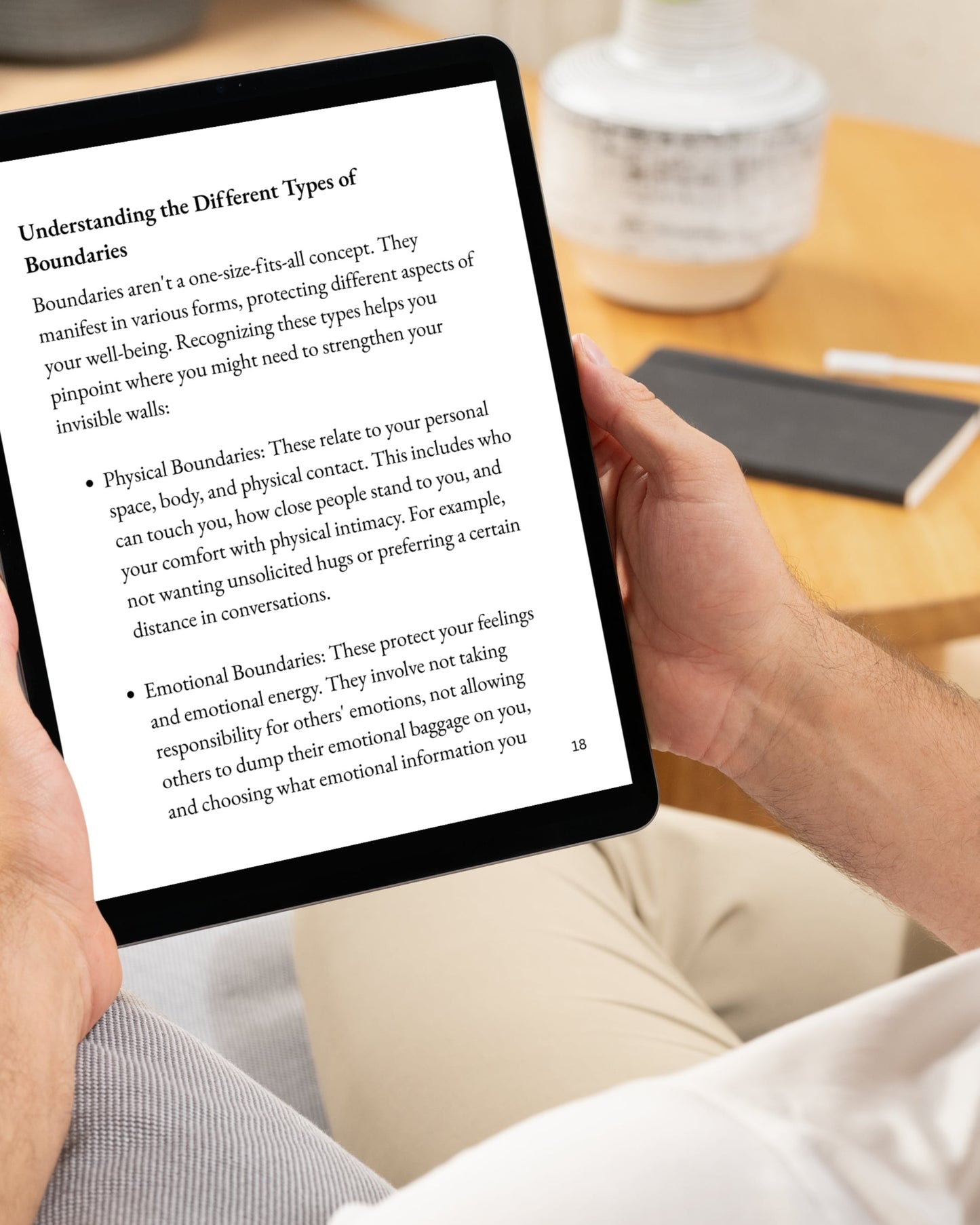 Person reading on a tablet in a home setting